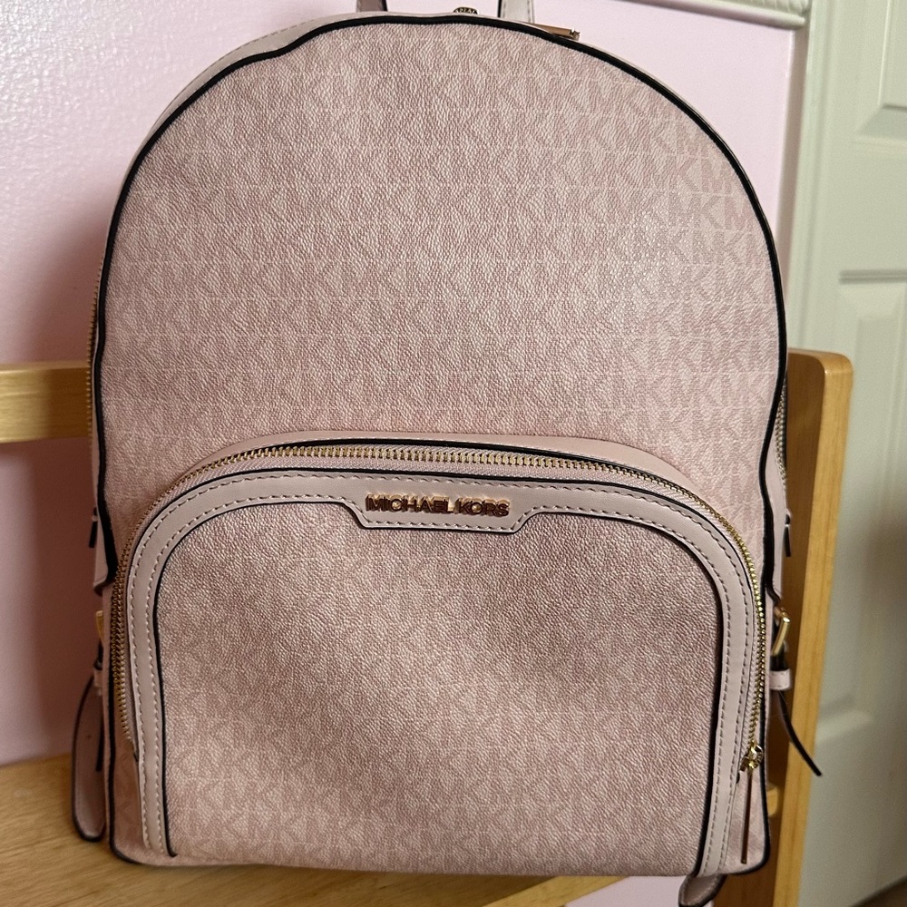 Michael Kors pink backpack practically new with tags